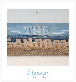 The sandbox signage with a caption of "Signage"