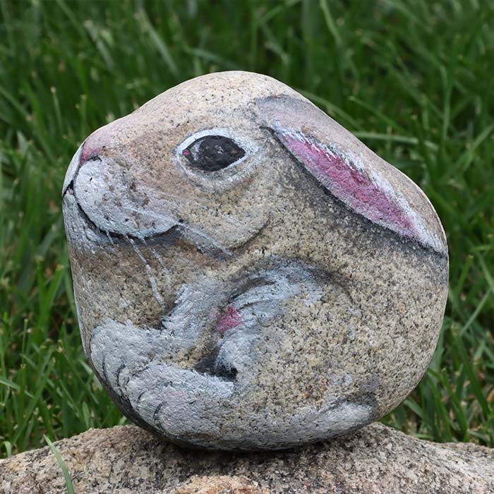 Rock painting of a bunny.