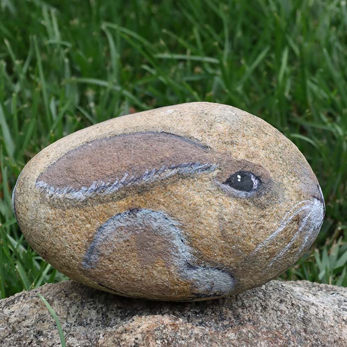 Rock painting of a bunny.