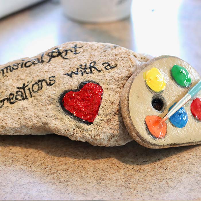 Whimsical Art creations with a heart rock painting.