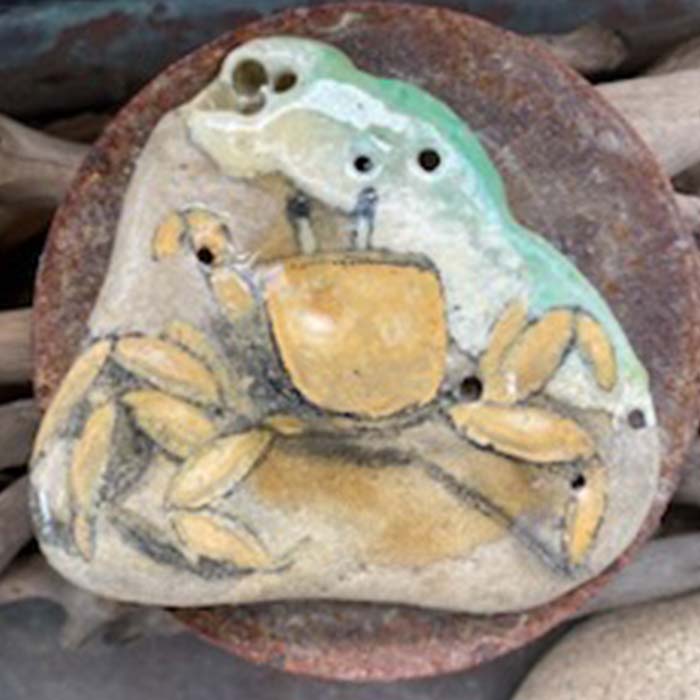 Yellow crab on rock painting.